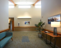 Hallway with plants and paintings